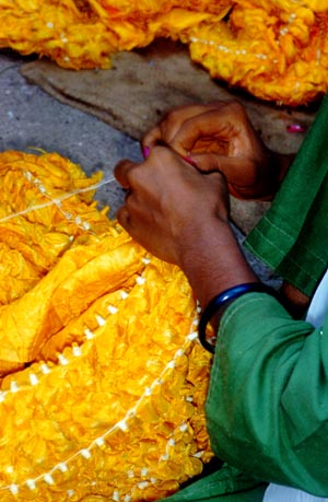 hands of an artist in the studio of Khatri Ali Mohamed Isha